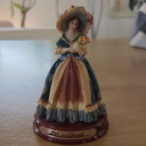 Louis Dionne Porcelain Figurine with Floral Dress